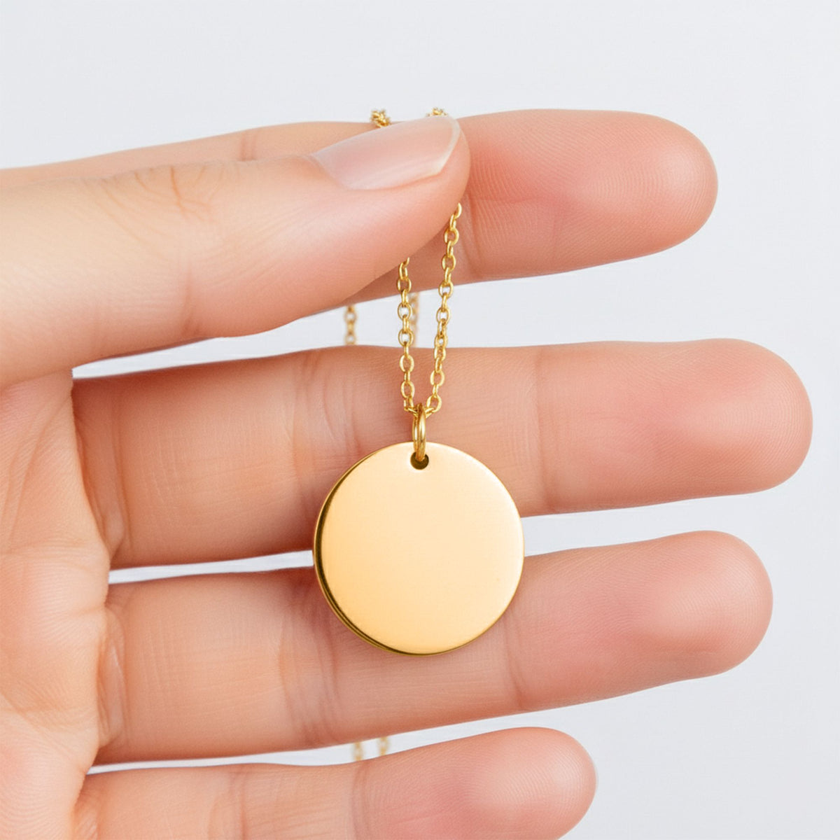 Gold-plated coin pendant necklace, shown blank before engraving (supplier photo)