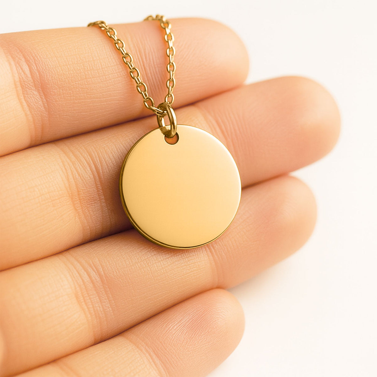 Gold-plated coin pendant necklace, shown blank before engraving (supplier photo)