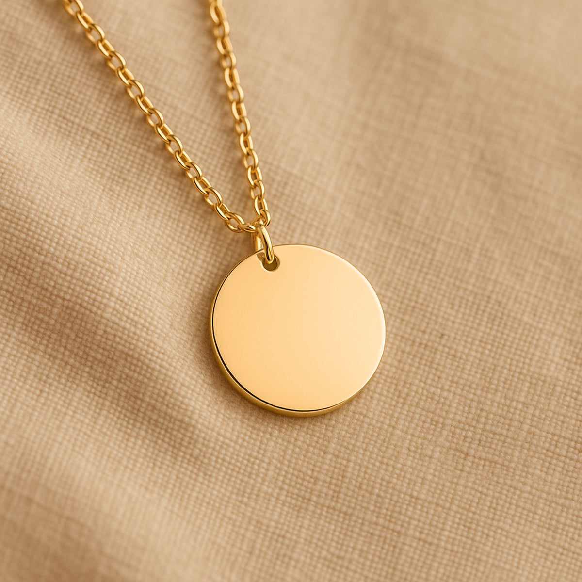 Gold-plated coin pendant necklace, shown blank before engraving (supplier photo)